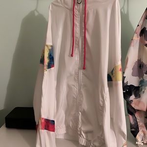 White/ multi colored zip up wind breaker size medium